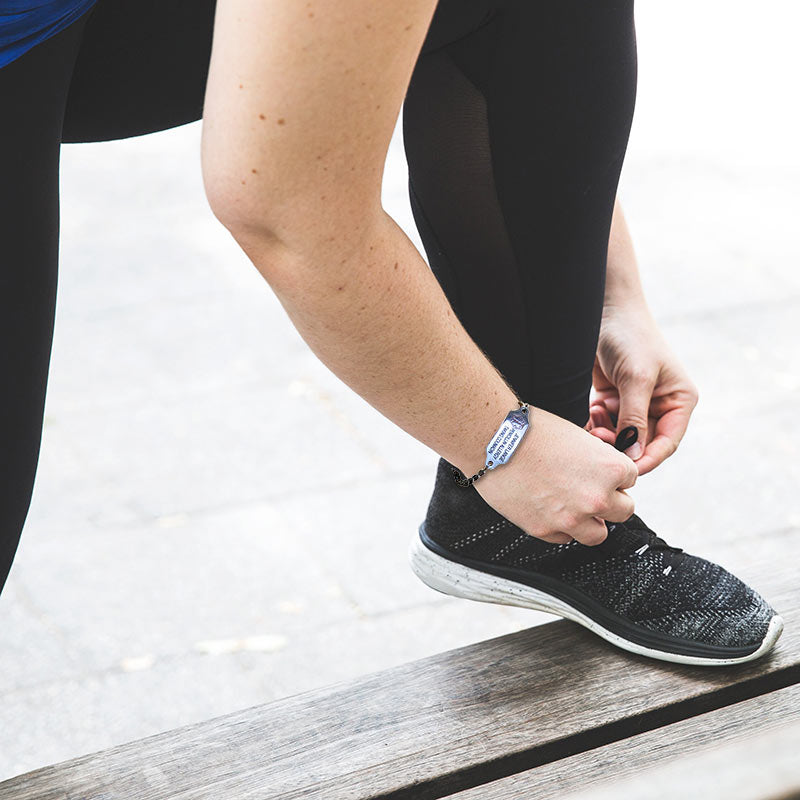 female runner wearing Smaller Size Stainless Steel Personalized Medical Bracelet